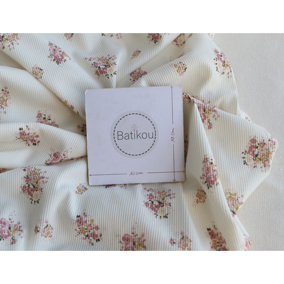 Jersey coton côtes fines à motif fleuri rose