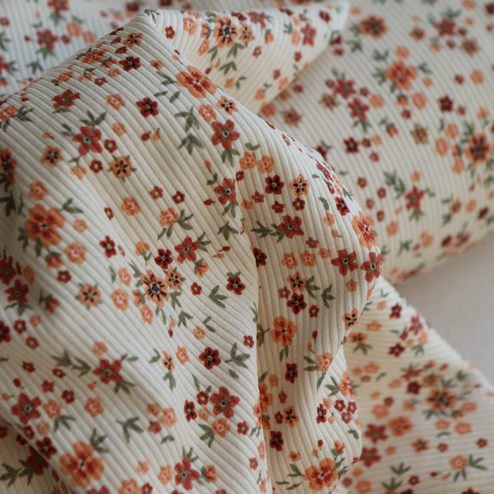 Jersey coton côtes fines à motif fleuri terracotta