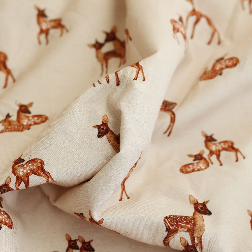 Bichette - Jersey coton à motif biches sur fond beige