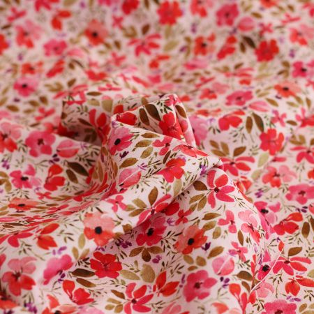 Jersey coton à motif fleuri rose