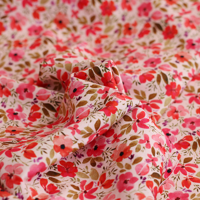 Jersey coton à motif fleuri rose