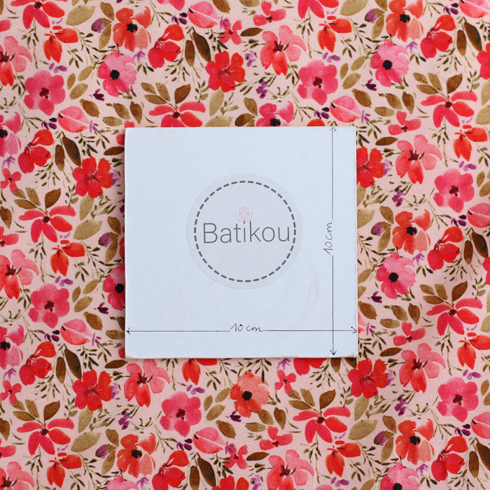 Jersey coton à motif fleuri rose