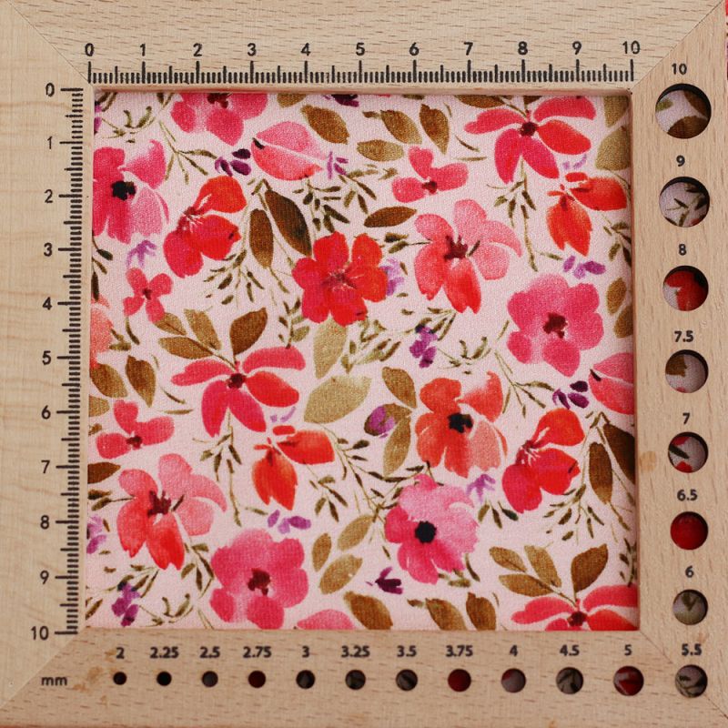 Jersey coton à motif fleuri rose