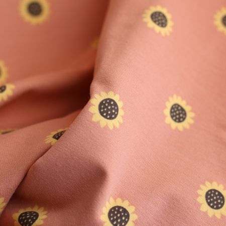 Jersey coton à motif fleurs de tournesol fond tomette clair Jersey coton à motif fleurs de tournesol fond tomette clair
