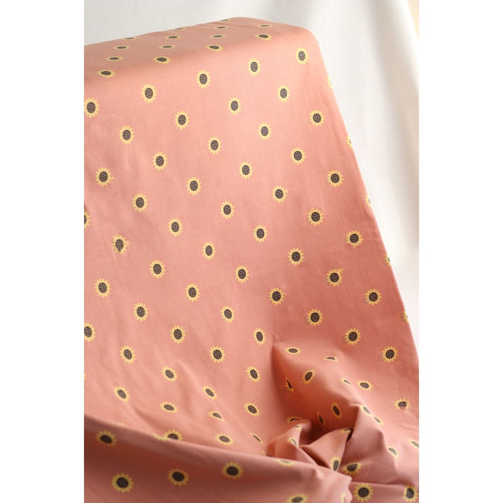 Jersey coton à motif fleurs de tournesol fond tomette clair