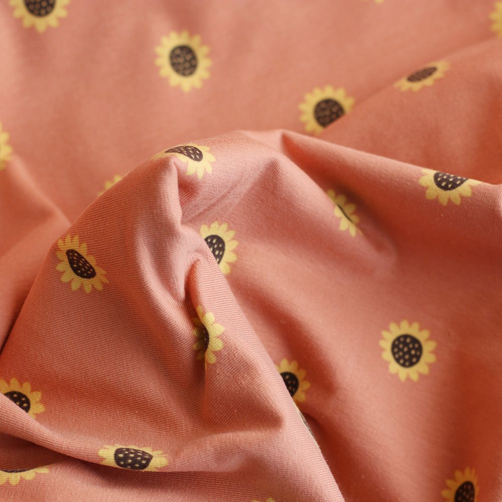 Jersey coton à motif fleurs de tournesol fond tomette clair