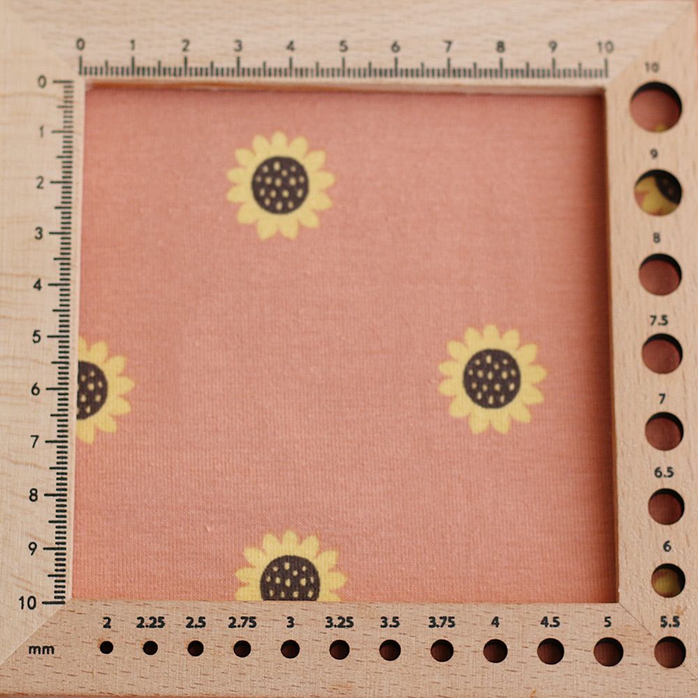 Jersey coton à motif fleurs de tournesol fond tomette clair