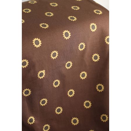 Jersey coton à motif fleurs de tournesol fond chocolat Jersey coton à motif fleurs de tournesol fond chocolat