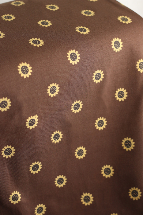 Jersey coton à motif fleurs de tournesol fond chocolat
