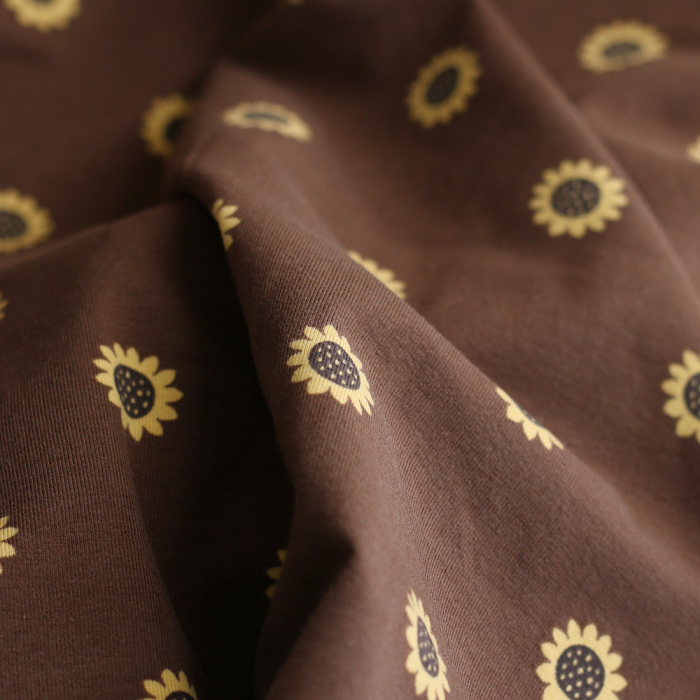 Jersey coton à motif fleurs de tournesol fond chocolat