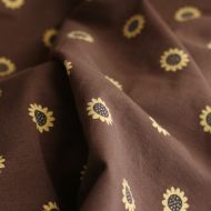 Jersey coton à motif fleurs de tournesol fond chocolat