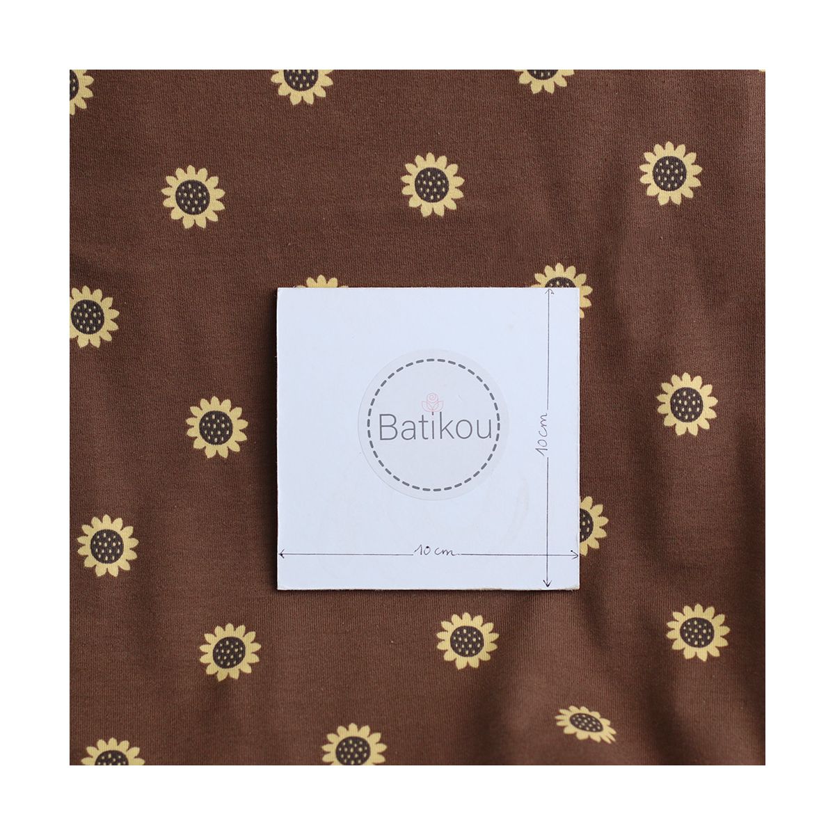 Jersey coton à motif fleurs de tournesol fond chocolat
