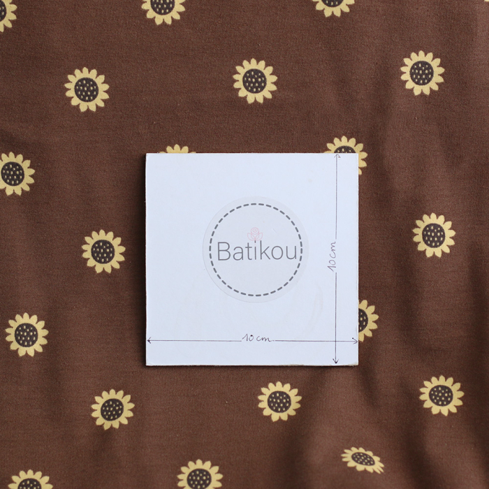 Jersey coton à motif fleurs de tournesol fond chocolat