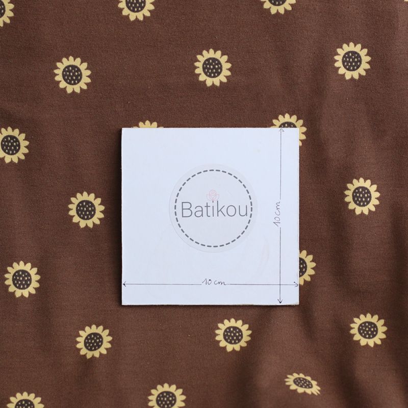 Jersey coton à motif fleurs de tournesol fond chocolat