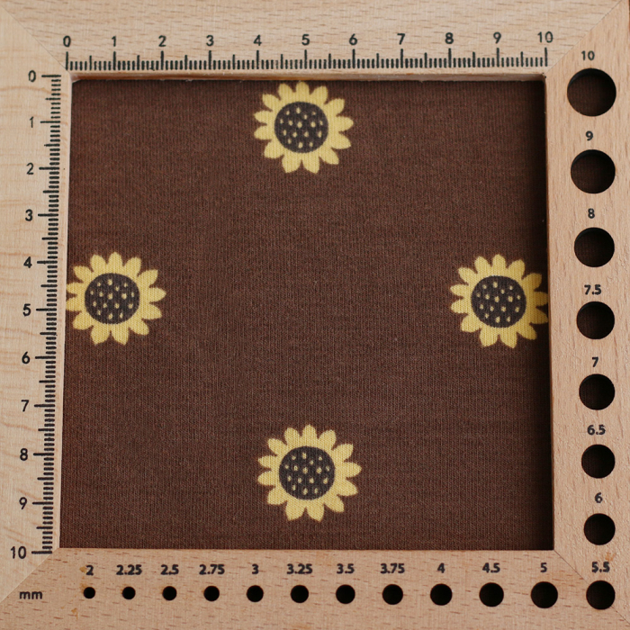 Jersey coton à motif fleurs de tournesol fond chocolat