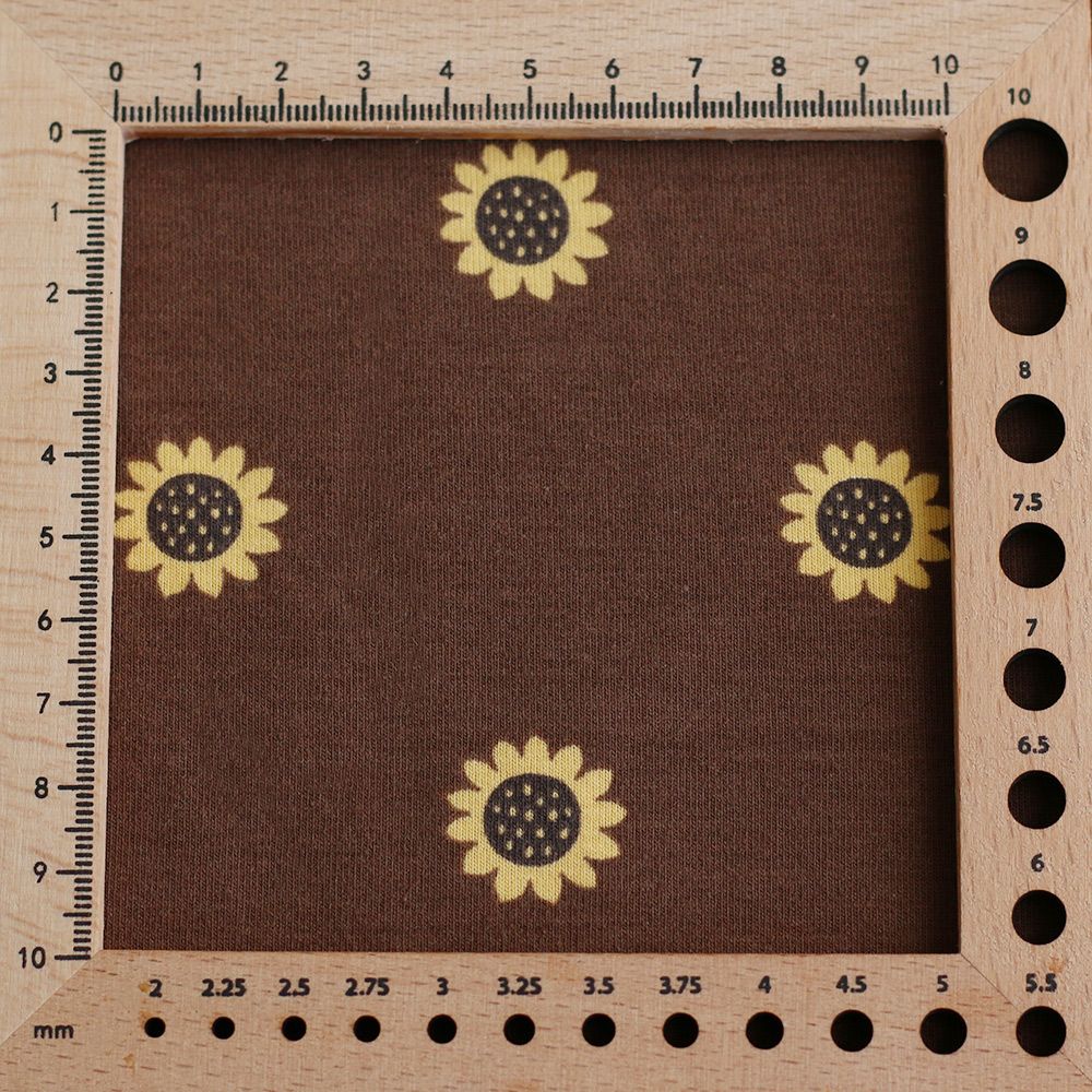 Jersey coton à motif fleurs de tournesol fond chocolat