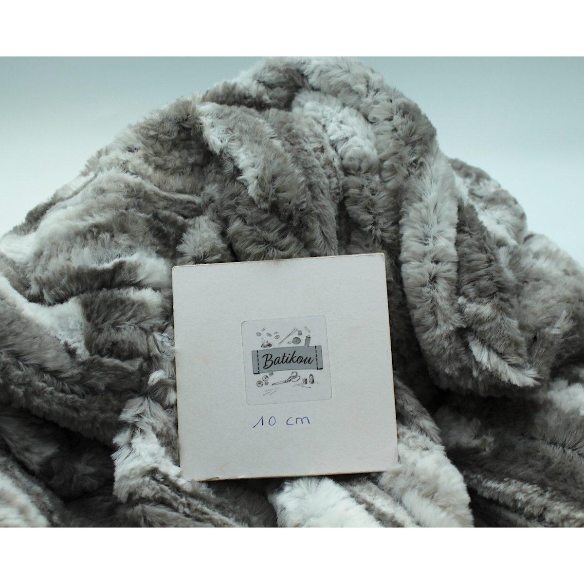 Fausse fourrure coloris gris clair