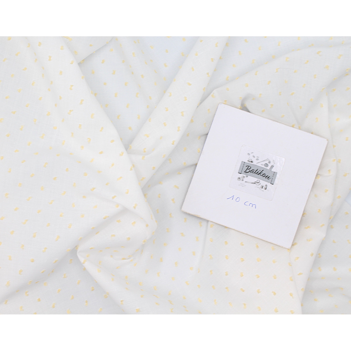 Plumetis de coton bicolore blanc et jaune clair