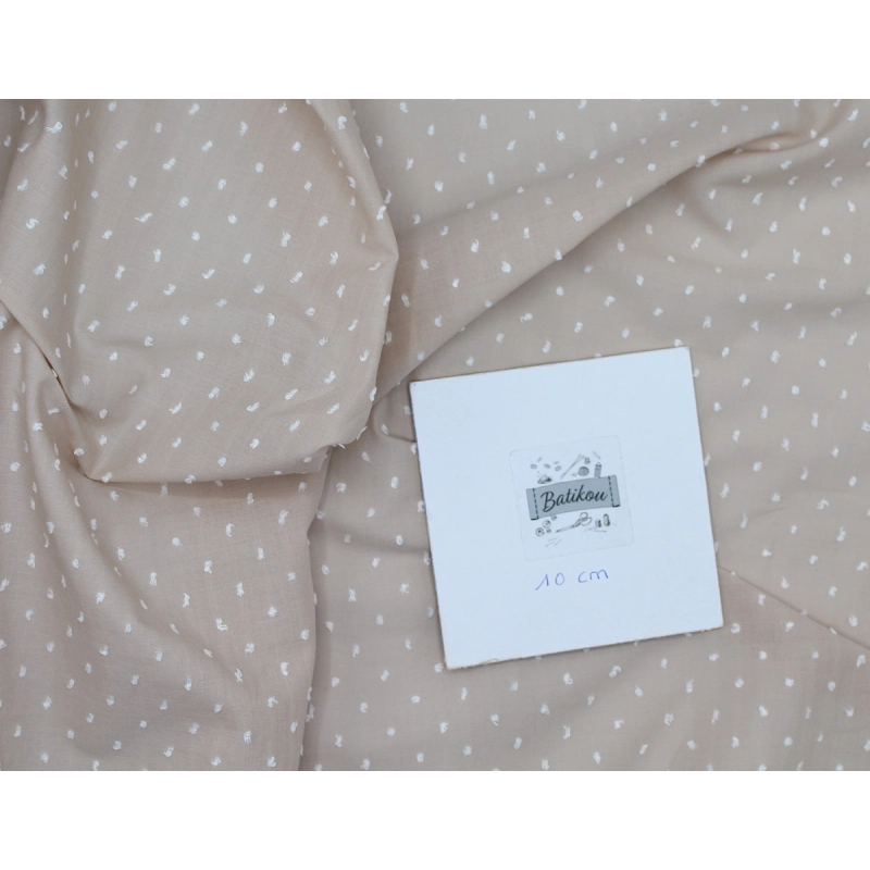 Plumetis de coton bicolore sable et blanc