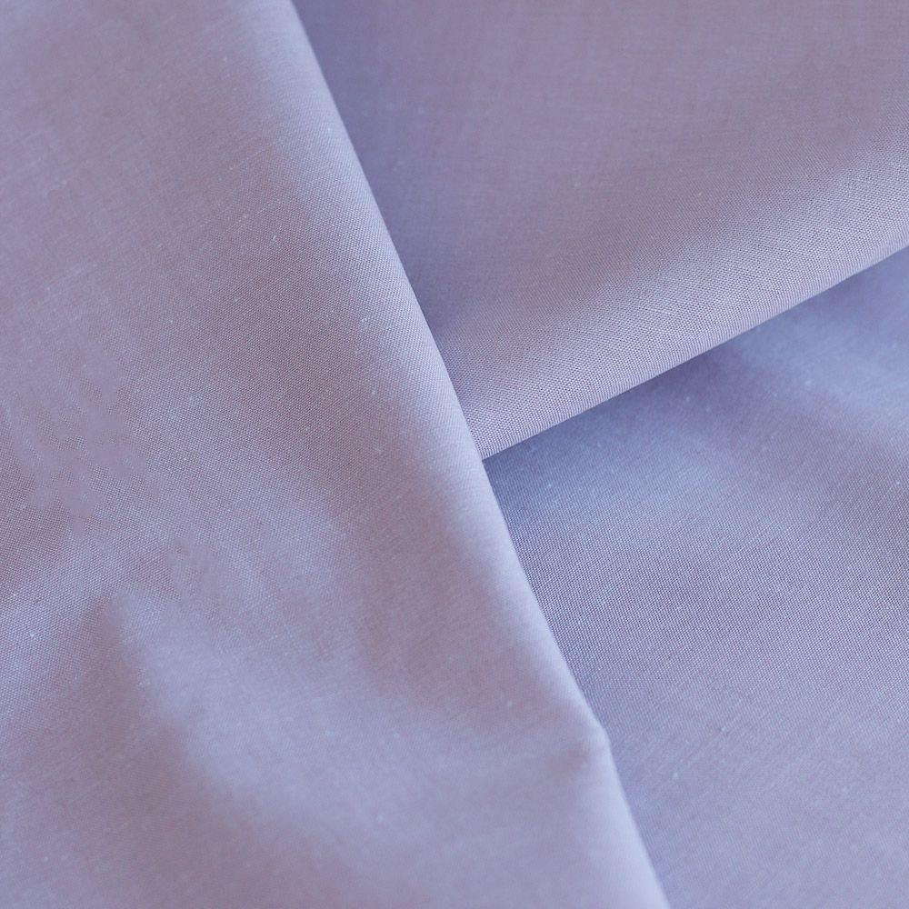 Popeline coton uni chiné effet chambray parme