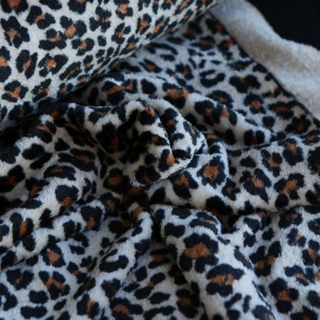 Graou - Polaire double face motif leopard sur fond beige Graou - Polaire double face motif leopard sur fond beige
