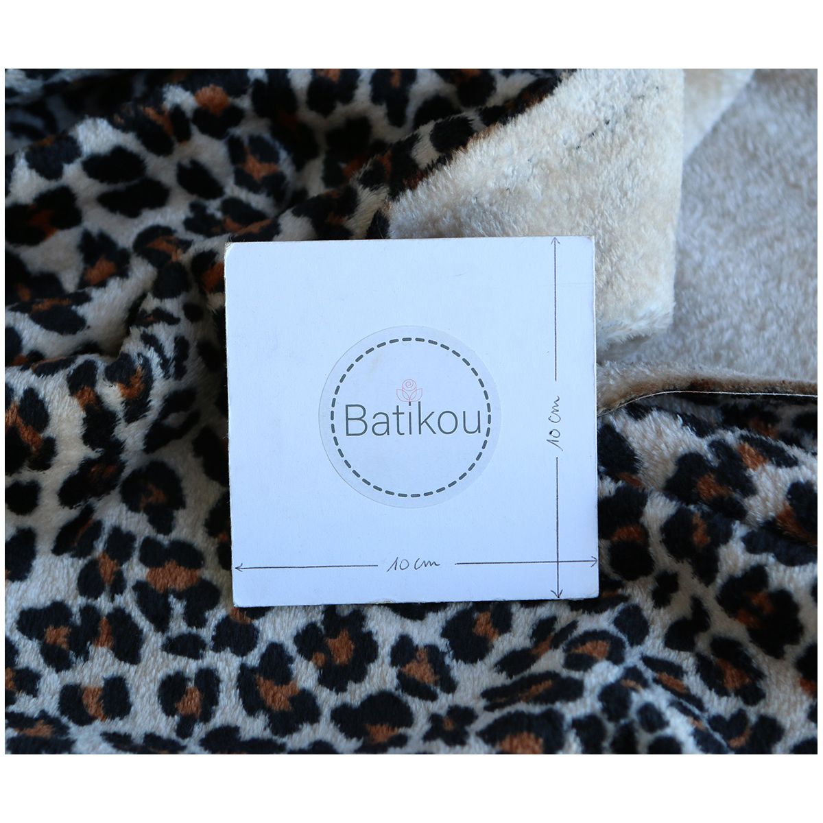 Graou - Polaire double face motif leopard sur fond beige Graou - Polaire double face motif leopard sur fond beige