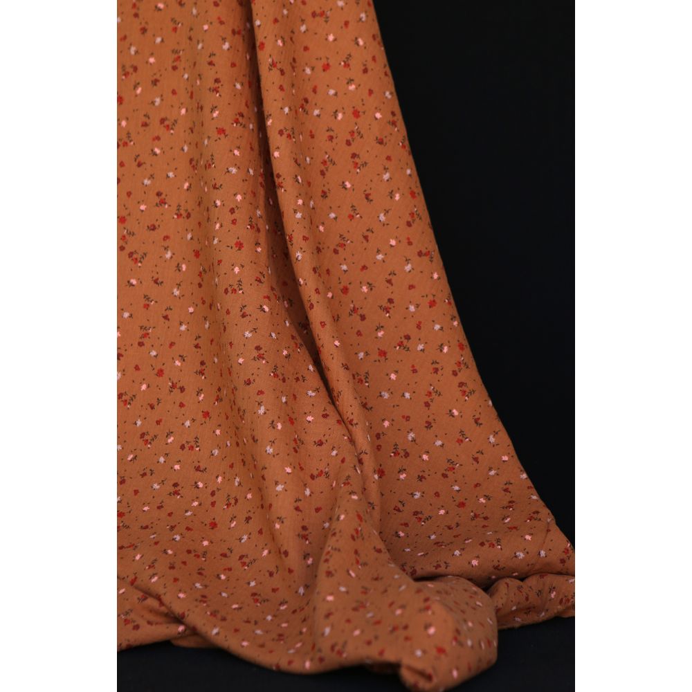 Double gaze de coton motif fleuri fond pain d'épices