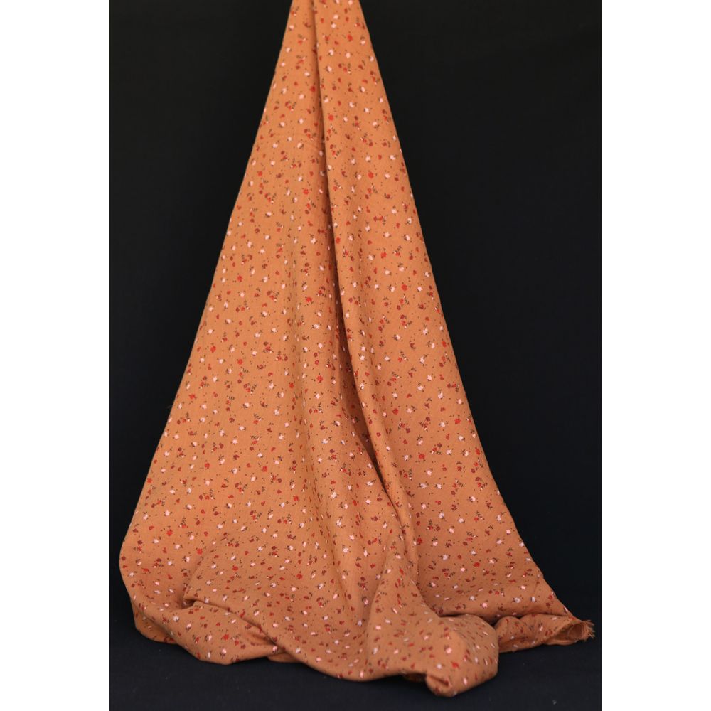 Double gaze de coton motif fleuri fond pain d'épices