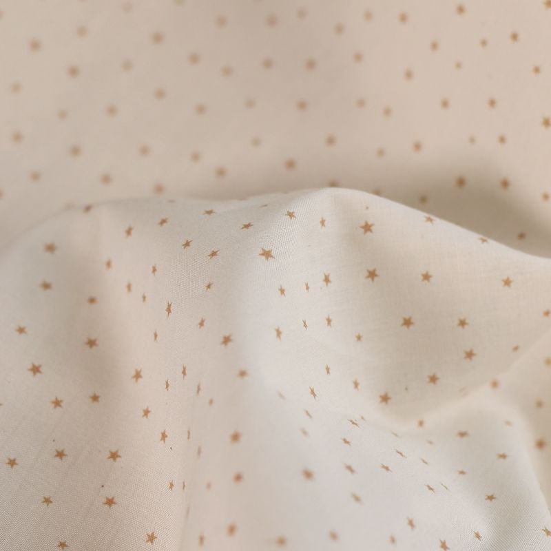 Star - Popeline douce coton organique fond ivoire petites étoiles moutarde