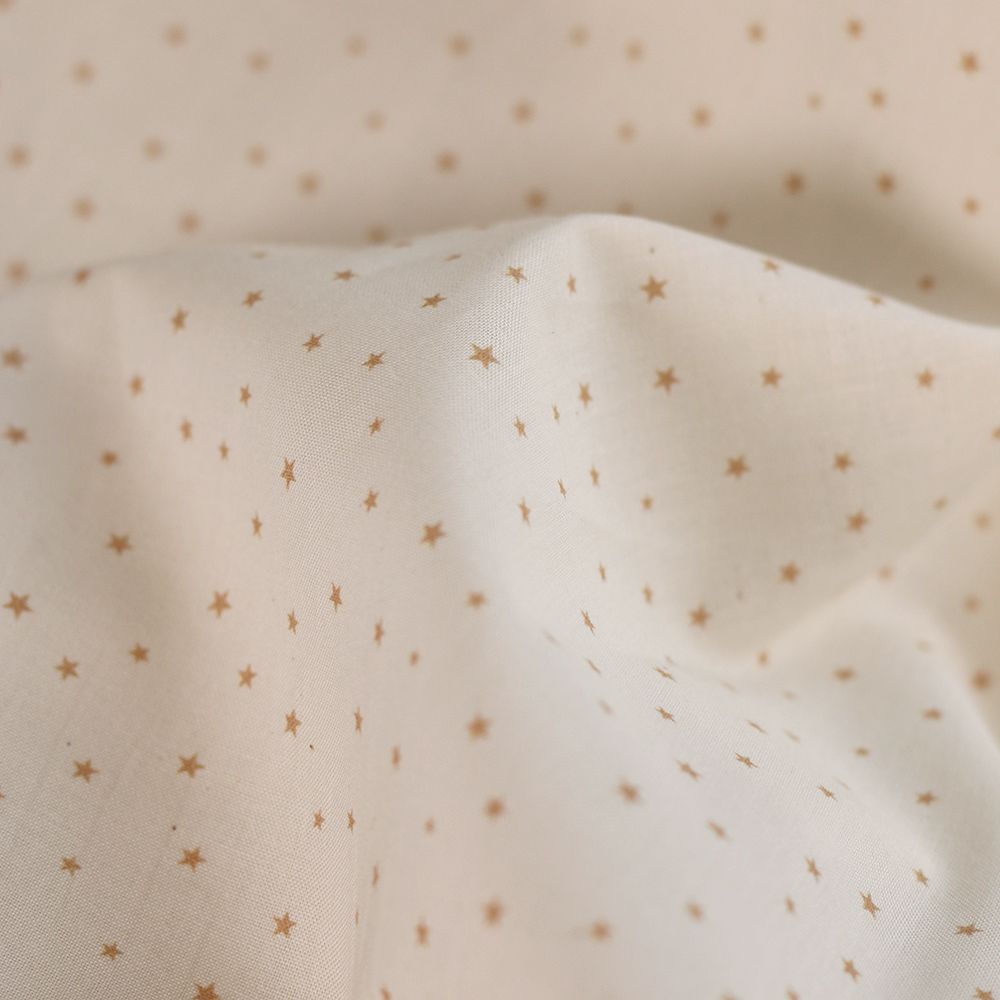 Star - Popeline douce coton organique fond ivoire petites étoiles moutarde