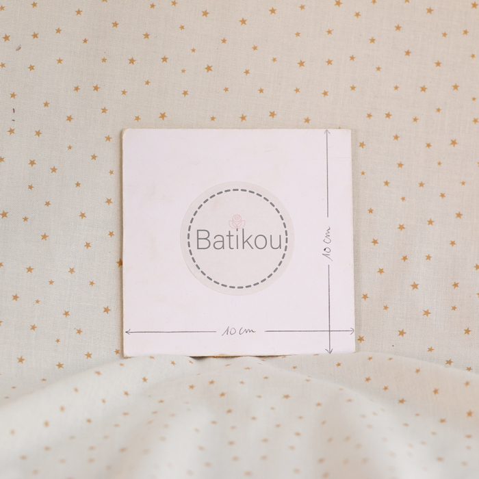 Star - Popeline douce coton organique fond ivoire petites étoiles moutarde