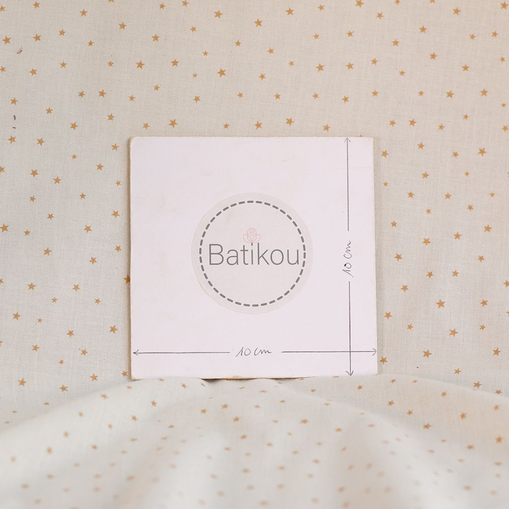 Star - Popeline douce coton organique fond ivoire petites étoiles moutarde