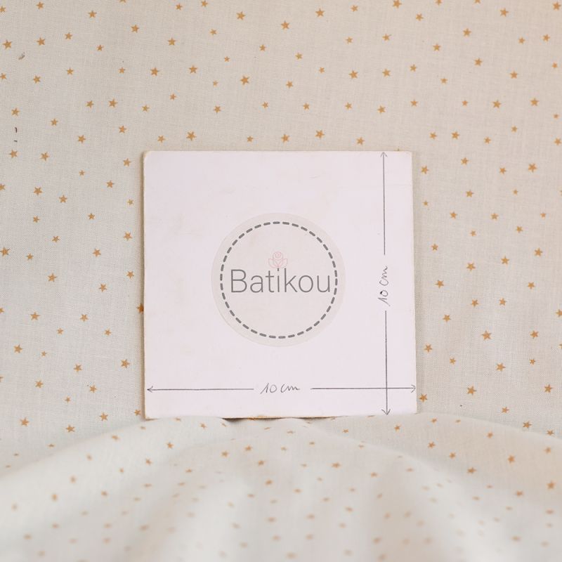 Star - Popeline douce coton organique fond ivoire petites étoiles moutarde