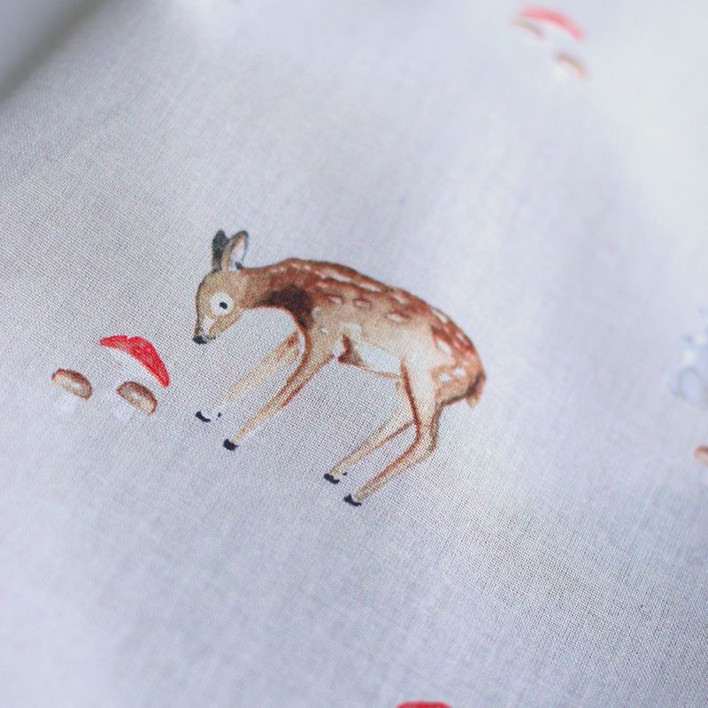 Bambi - Popeline de coton fond beige motif biche, lapin et champignons
