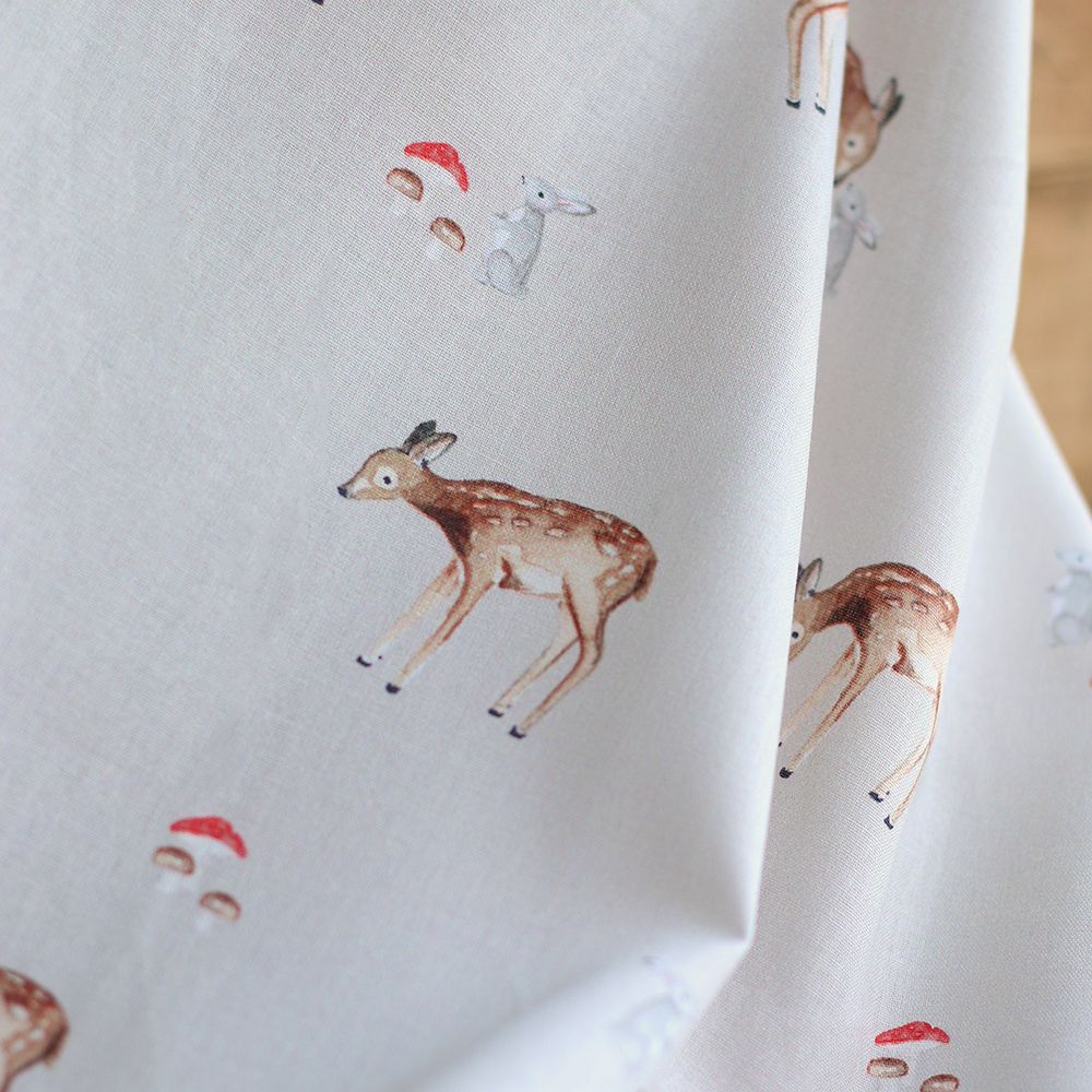 Bambi - Popeline de coton fond beige motif biche, lapin et champignons