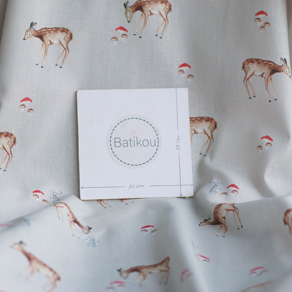 Bambi - Popeline de coton fond beige motif biche, lapin et champignons