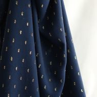 Viscose uni plumetis doré coloris bleu marine