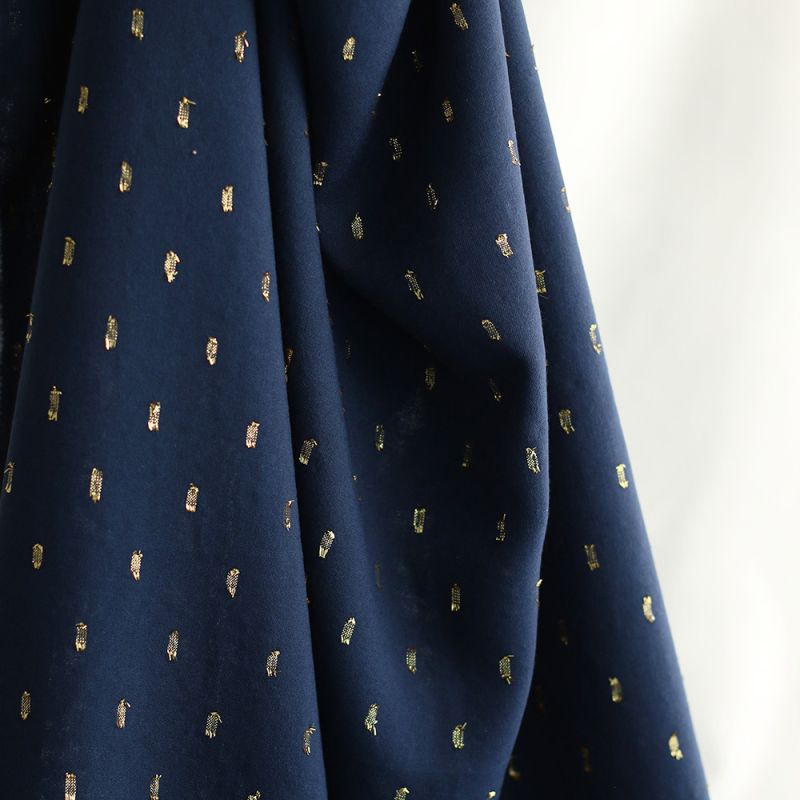 Viscose uni plumetis doré coloris bleu marine