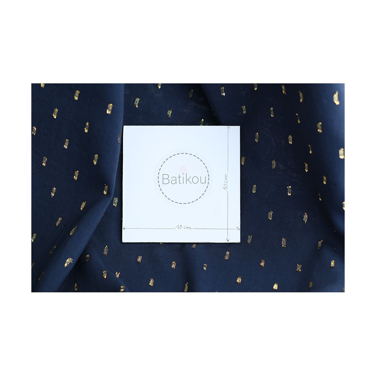 Viscose uni plumetis doré coloris bleu marine