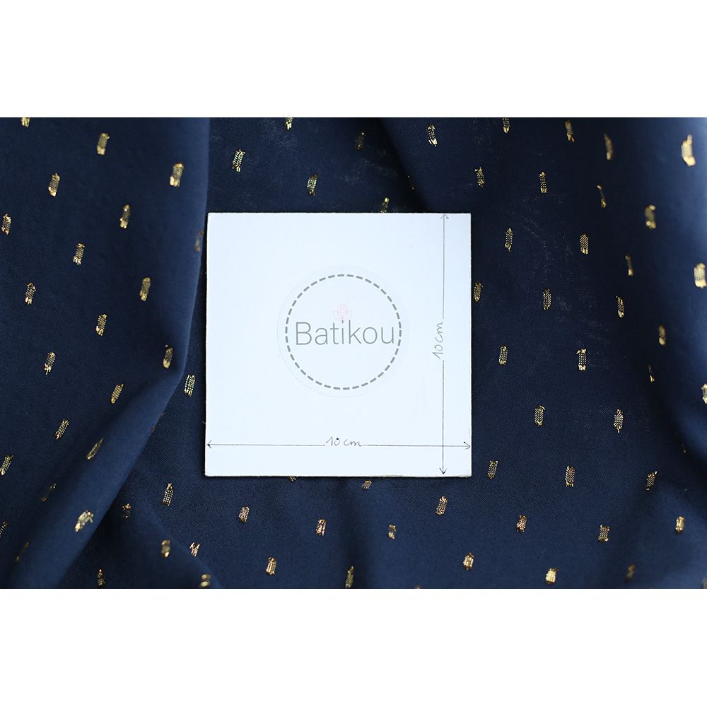 Viscose uni plumetis doré coloris bleu marine