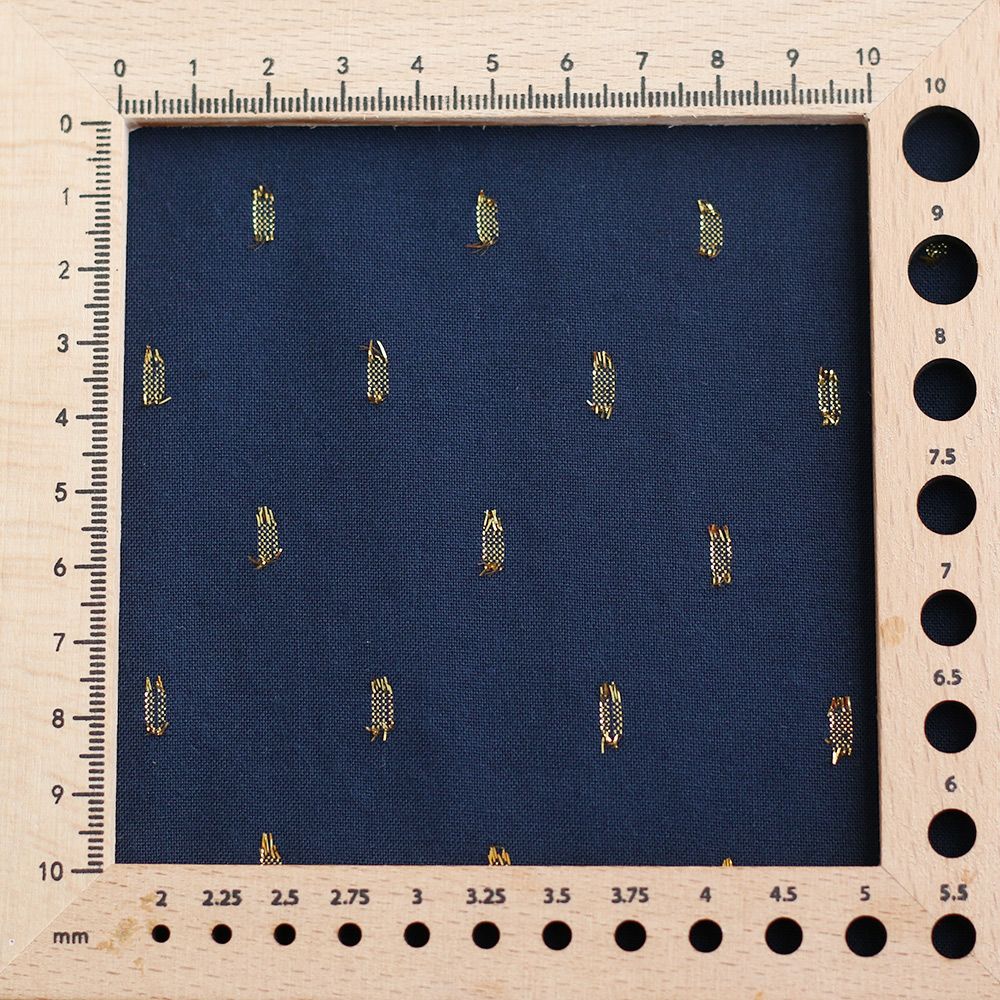 Viscose uni plumetis doré coloris bleu marine