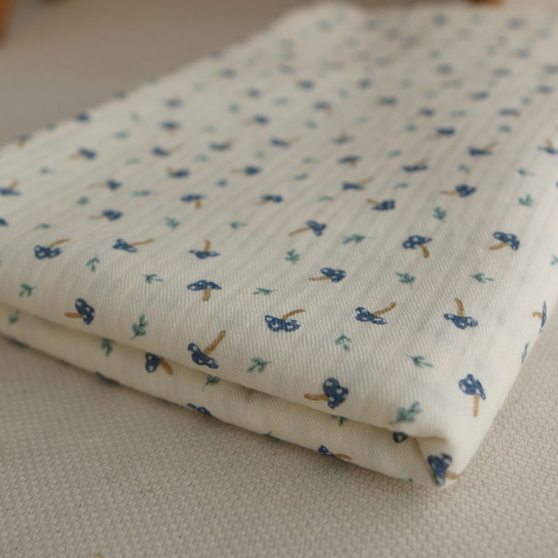 Mario - Seersucker / Coton gaufré doux fond écru champignons bleus