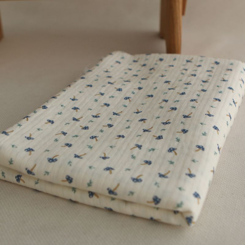 Mario - Seersucker / Coton gaufré doux fond écru champignons bleus