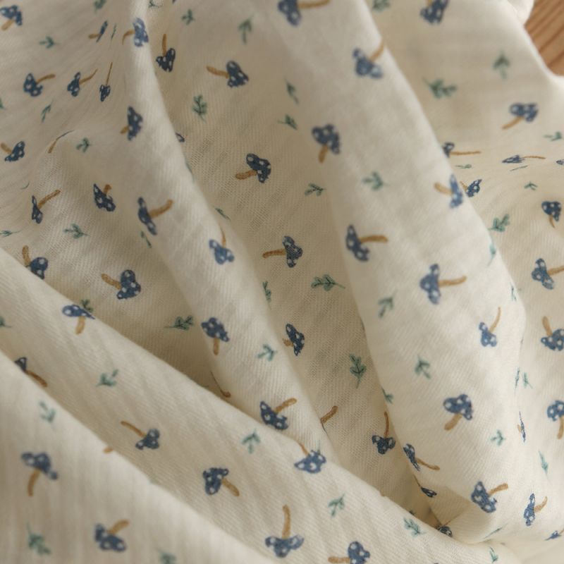 Mario - Seersucker / Coton gaufré doux fond écru champignons bleus