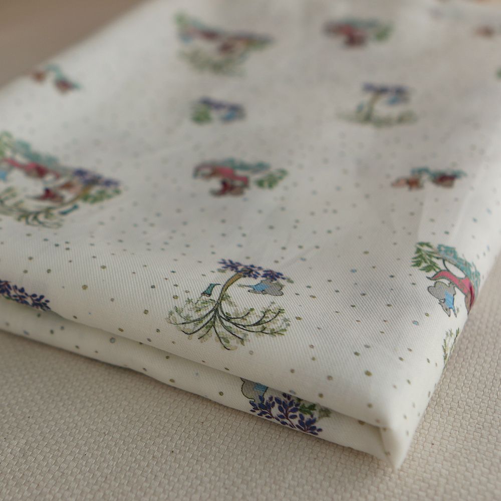 Panache - Tissu sergé de coton organique fin imprimé petits écureuils