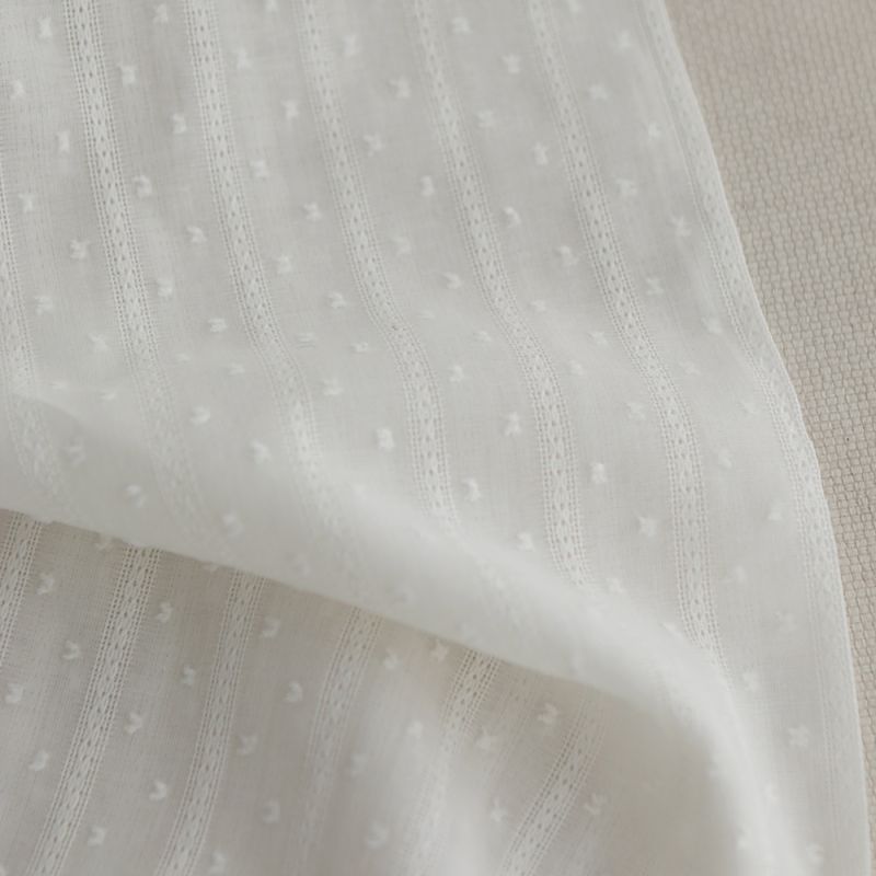 Broderie anglaise plumetis coton coloris blanc cassé