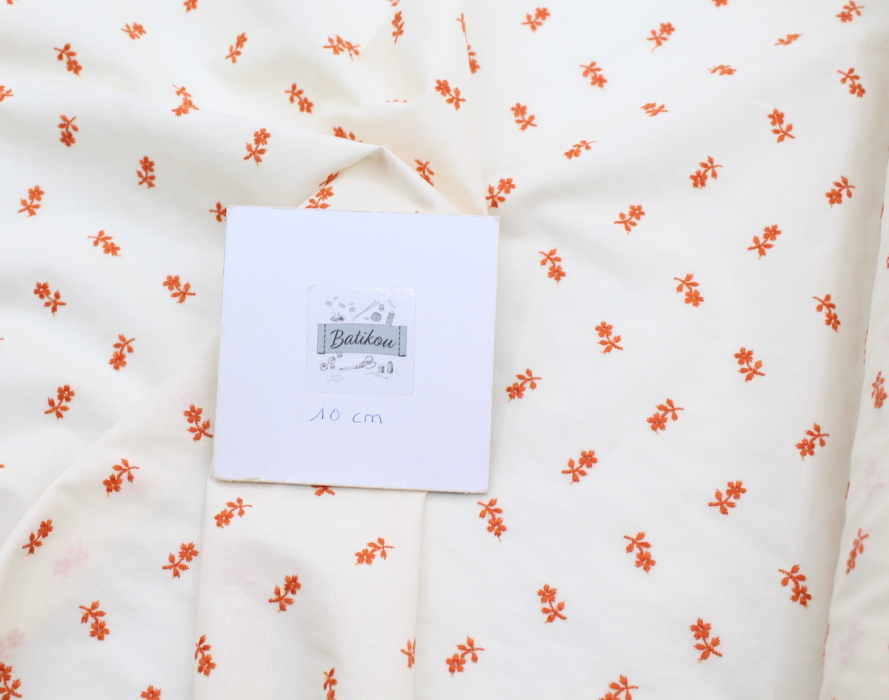 Tissu coton organique broderies fleurs coloris orange
