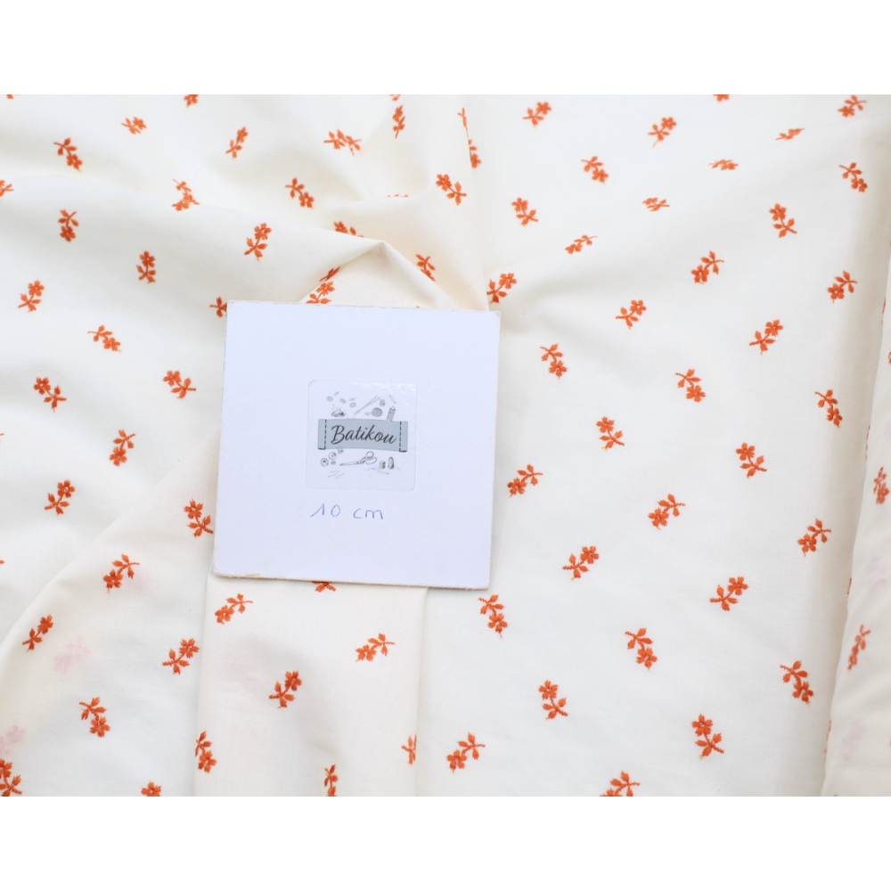 Tissu coton organique broderies fleurs coloris orange