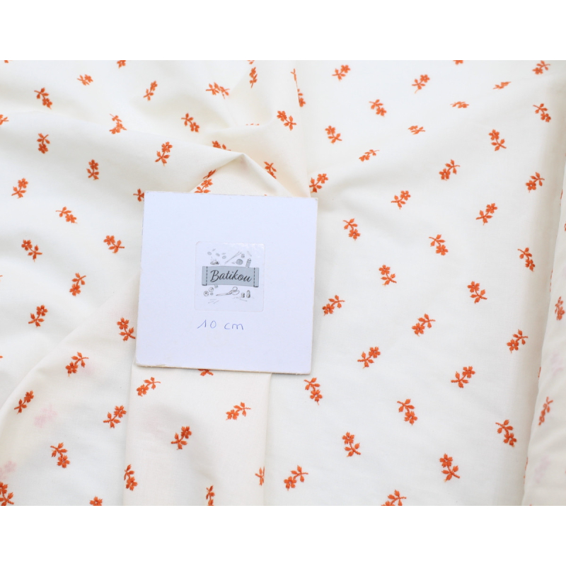 Tissu coton organique broderies fleurs coloris orange