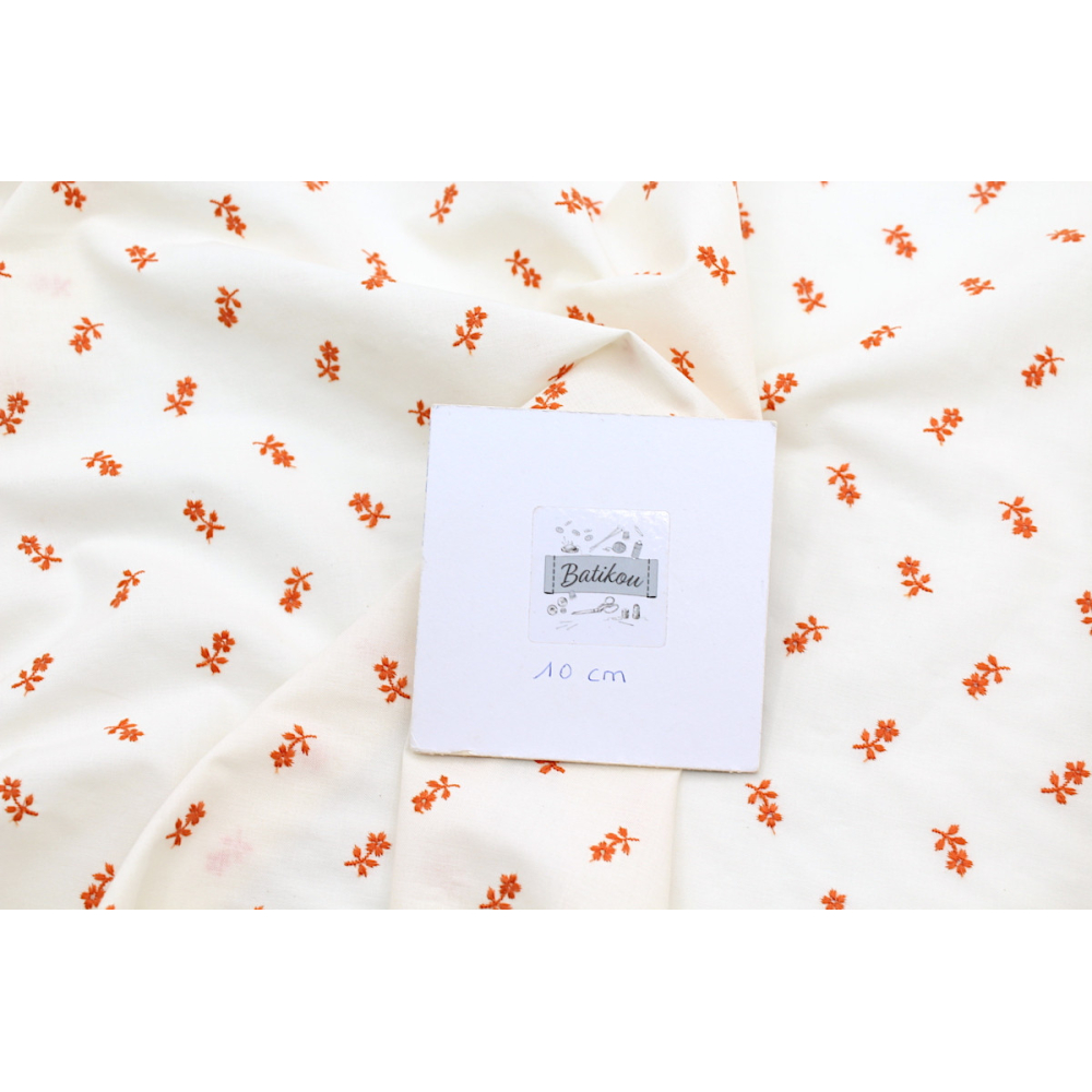 Tissu coton organique broderies fleurs coloris orange